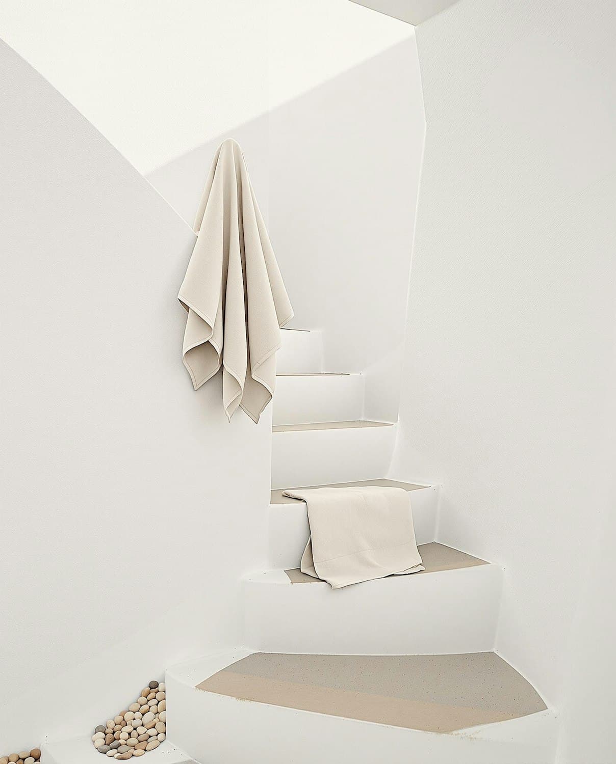 Whitewashed stair with linen hung on the wall